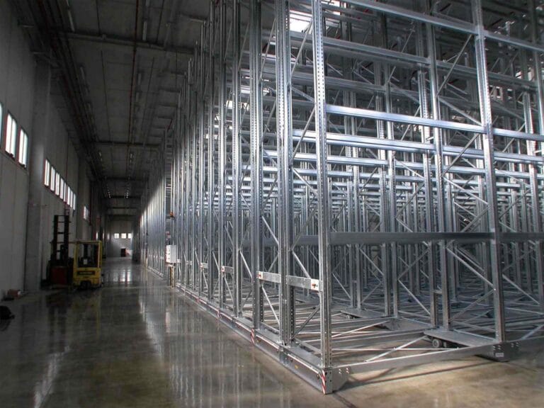 Spacious warehouse with metal shelving units.